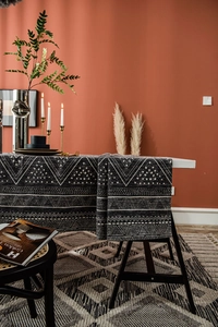 Detailed view of the thick cotton linen fabric with white geometric patterns on black runner