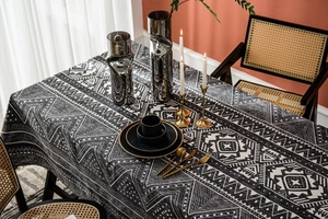 Close-up of geometric triangle pattern on gray cotton linen tablecloth with boho texture