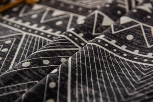 Macro view of geometric triangle print on heavy grey cotton linen tablecloth fabric