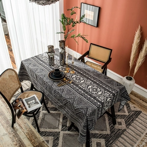 Linen rectangle tablecloth featuring grey geometric triangle patterns and boho tassel edges