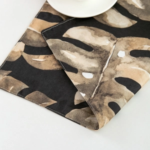 Nordic monstera leaf table runner with dark tropical pattern on thick cotton linen fabric