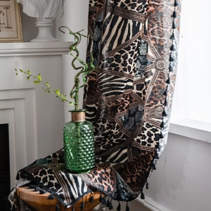 Bohemian curtain with mixed leopard and zebra animal prints and elegant black tassels
