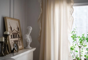 Detailed texture of French cream cotton linen curtain with decorative ruffle edges