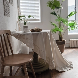 Elegant cream white washed cotton round tablecloth with ruffled edge for dining tables