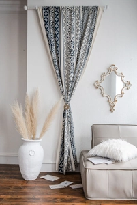 Detail of bohemian mandala print curtain with retro elk relief decorative buckle