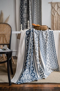 Detail showing bohemian blue floral pattern on thick linen blend tablecloth fabric
