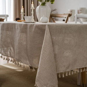Beige linen tablecloth with tassels and a minimalist Nordic style for home dining tables