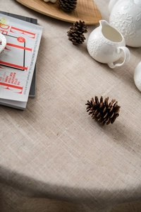 Detail of minimalist linen tablecloth texture with elegant home decor and accessories