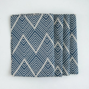 Set of 4 navy blue geometric jacquard table mats with herringbone woven texture