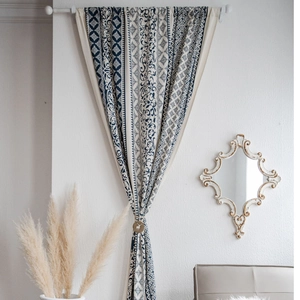 Bohemian blue and white printed cotton linen curtains with a reindeer motif tieback