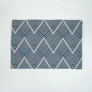 Navy blue rectangular placemat with woven herringbone geometric patterns for dining decor