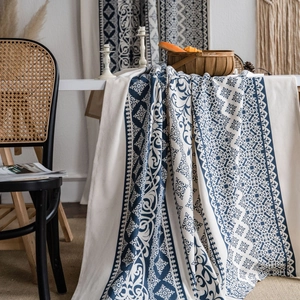 Blue bohemian patterns on white cotton linen tablecloth with ethnic geometric design