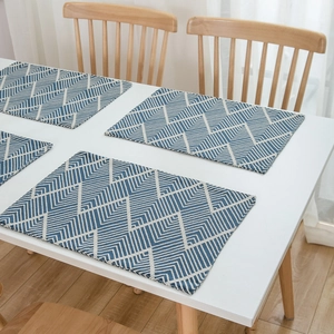 Set of 4 navy blue wave jacquard placemats with geometric herringbone pattern