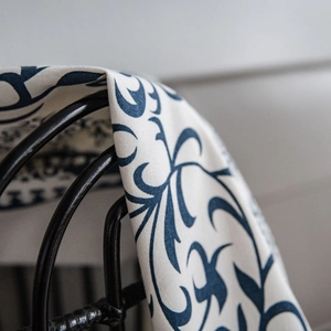 Blue botanical print cotton linen curtain fabric with detailed floral vine patterns