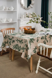 Detail of American-style pine pattern tablecloth in thick beige linen with rustic natural texture