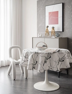 Macro detail of round marble pattern tablecloth with modern minimalist Nordic home decor