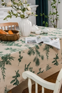 Detail of pine tree pattern on beige cotton linen tablecloth with elegant home decor