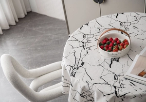Detailed view of round marble print tablecloth with modern minimalist crackle pattern
