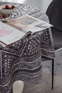 Close-up of bohemian geometric print on round cotton linen tablecloth for modern home decor