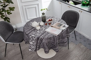 Detail shot of a round Bohemian tablecloth with black and white geometric ethnic patterns