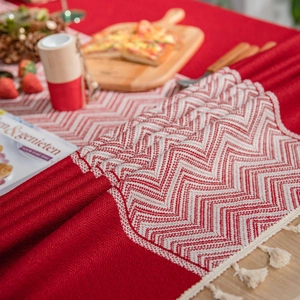 Red herringbone jacquard tablecloth with white tassels for festive dining decor