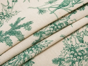 Detailed texture of thick cotton linen fabric with green pine needle and berry print
