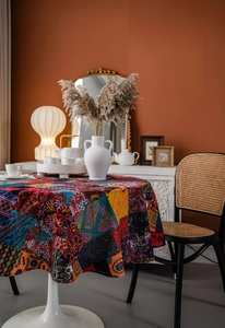 Detail of round tablecloth featuring bohemian patchwork prints and vibrant ethnic patterns