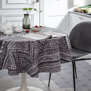 Bohemian round tablecloth with dark gray and white geometric tribal patterns for dining