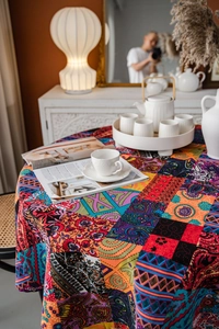 Detailed macro view of bohemian tablecloth with colorful paisley and floral patterns