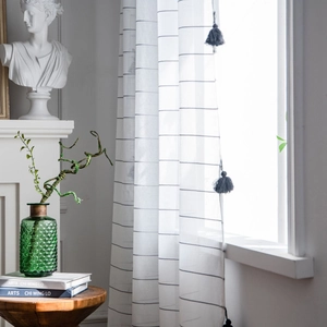 Modern white striped sheer curtain with black tassel details for elegant home decor