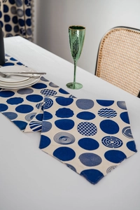 Close-up of Nordic table runner with blue geometric circles on premium fabric