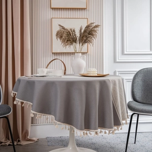 Elegant grey round tablecloth with white tassel fringe for dining tables and home decor