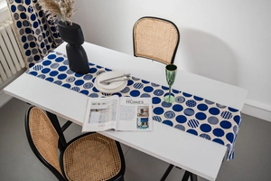 Detail of blue and beige geometric print table runner made of thick cotton linen fabric