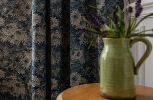 Detailed shot of vintage blue floral curtain with premium jacquard texture and tassel fringe