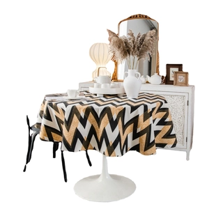 Bohemian gold wavy geometric print round tablecloth on white tulip dining table