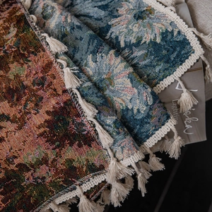 Artistic oil painting style blue flower woven tapestry throw with elegant fringe edges