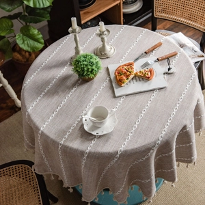 Round linen blend tablecloth with white leaf embroidery and tassel fringe decor