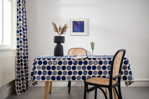 Detail view of royal blue polka dot cotton linen tablecloth and matching curtains set