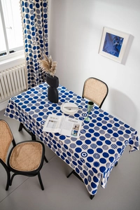 Detail of navy blue geometric dots printed on white cotton linen rectangular tablecloth