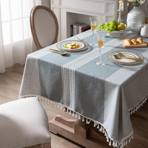 Modern grey and blue patchwork cotton linen tablecloth with white geometric fringe and tassels