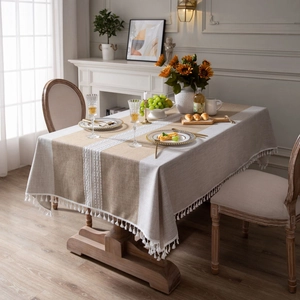 Bohemian brown linen tablecloth with white lace stitching and cotton pom pom tassels