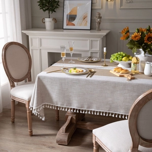Linen style brown rectangular tablecloth with white lace center and elegant tassel edges