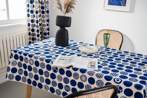 Close-up of dark blue and white polka dot pattern on modern cotton linen tablecloth
