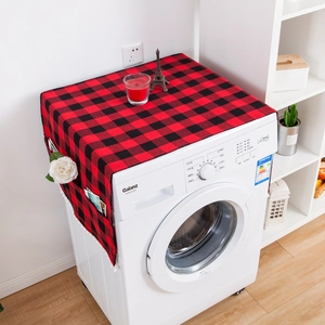 Red and black buffalo plaid washing machine cover with side pockets and tassel trim