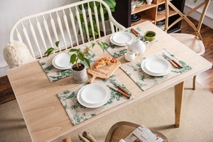 Set of 4 table placemats with green pine and bird prints on beige linen fabric