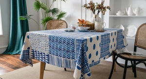Detailed view of blue geometric拼接 cotton linen tablecloth with elegant draping edge