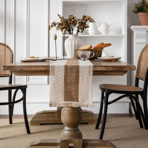 Linen table runner with cream and brown patchwork, lace edges and fringe tassels