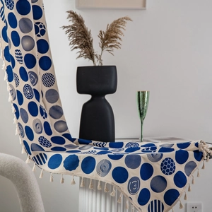 Bohemian style table runner with blue geometric dot patterns and fringe trim details