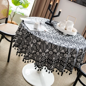 Nordic round tablecloth with black geometric tribal patterns and fringed tassel edges