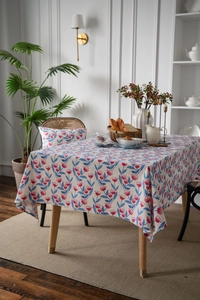 Detailed view of floral cotton linen tablecloth with pink tulips and blue leaves